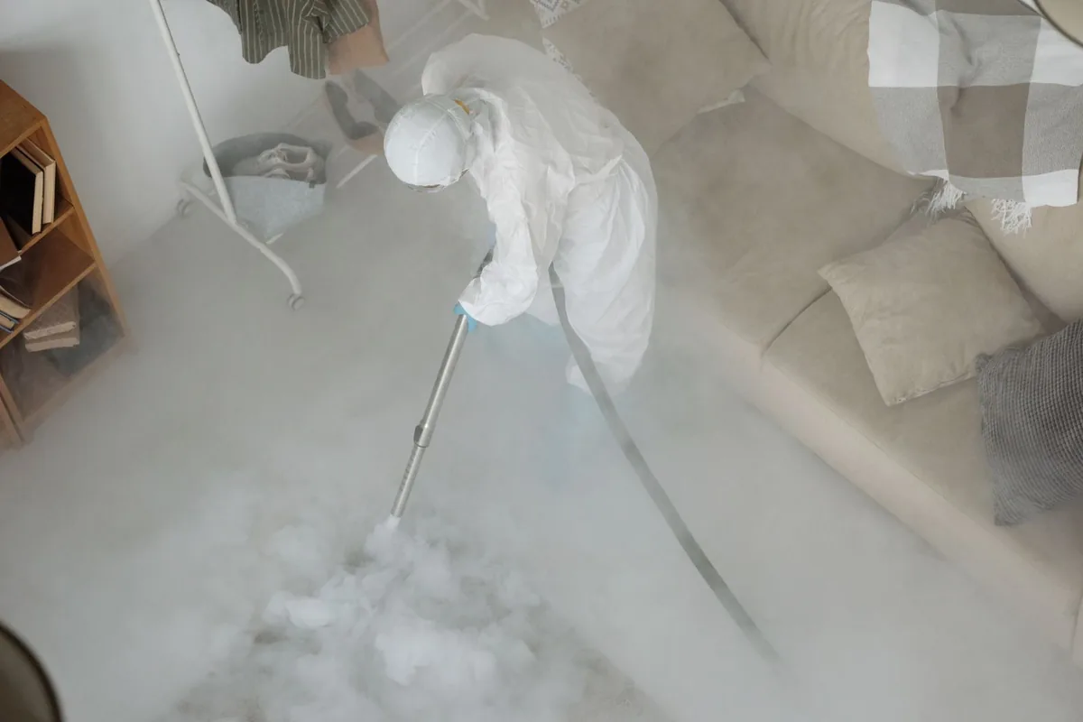 Biohazard cleanup technician in protective equipment, Lookout Mountain, TN
